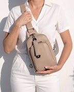 Woman wearing a  Cakes crossbody concealed carry bag