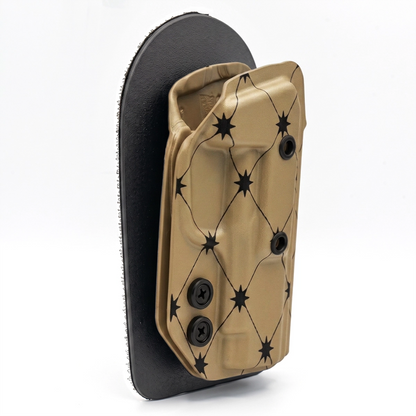 CAKES CONCEALED PRINTED ALMOND HOLSTER ON A BLACK VELCRO BACKER SIDE ANGLE.