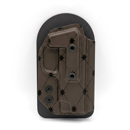CAKES CONCEALED PRINTED CHOCOLATE HOLSTER ON A BLACK VELCRO BACKER.