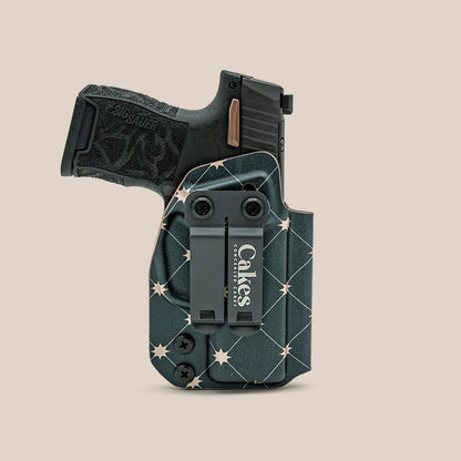 Rose gold metallic patterned IWB holster with black belt clip.